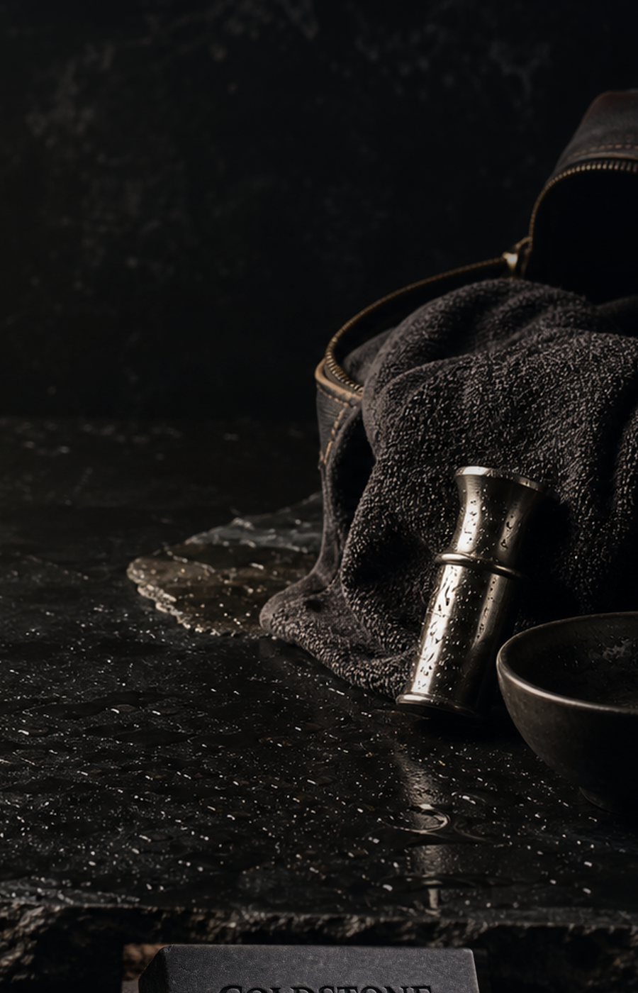 Coldstone Soap Co. bar with wet stone, canvas, and steel grooming kit materials